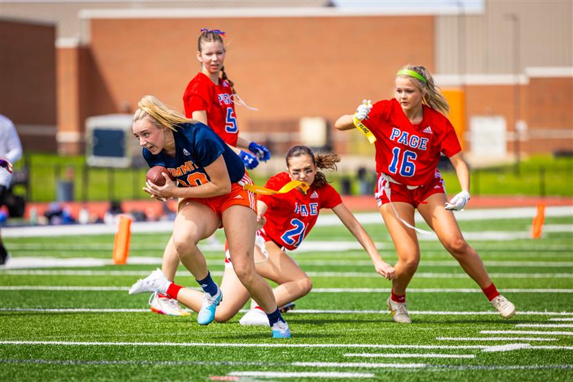 Students play flag football